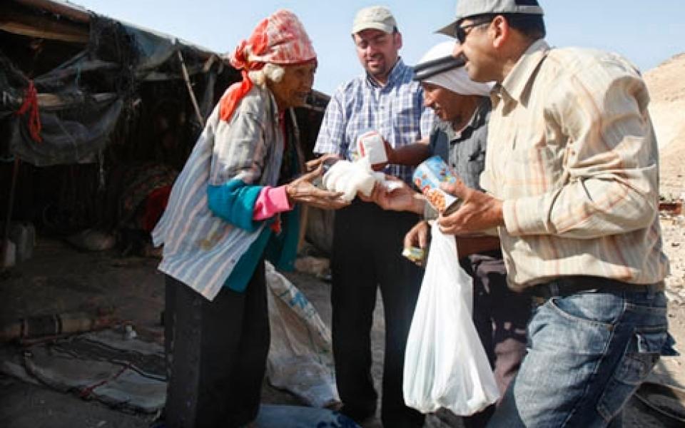 A man giving out food 