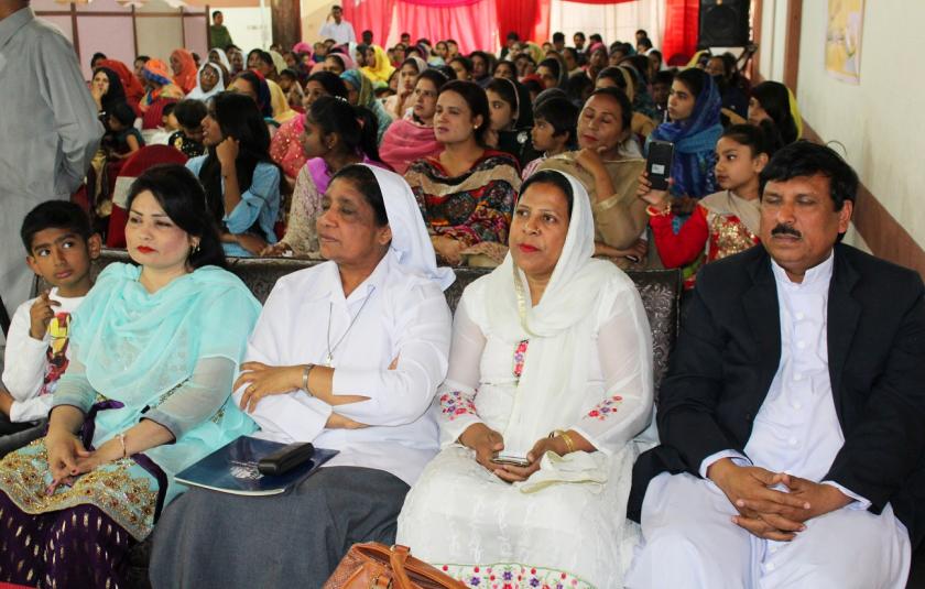 Photo of a group of Pakistani people sitting at an event