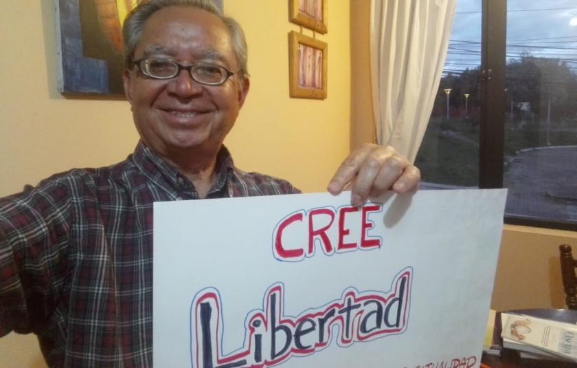 Photo: sigh with words of hope choosen by URI Latin America & Caribbean - An URI member holding a sigh written Liberty 