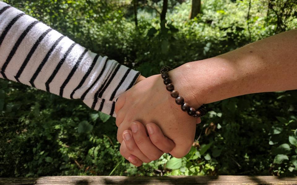 Women holding hands