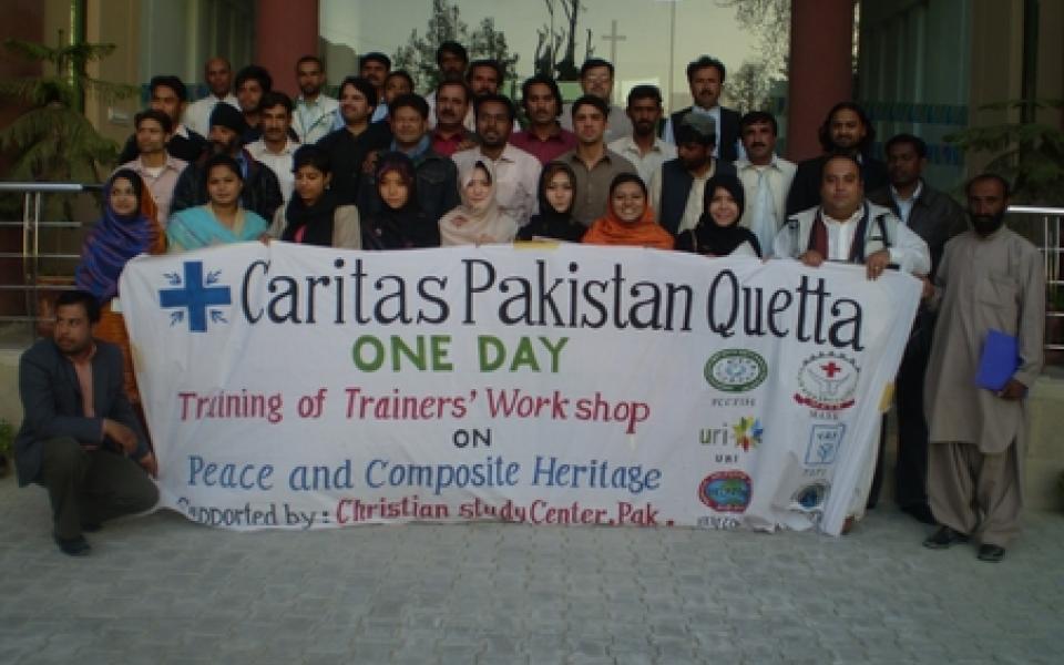people holding on the Charting a new path for Quetta poster 