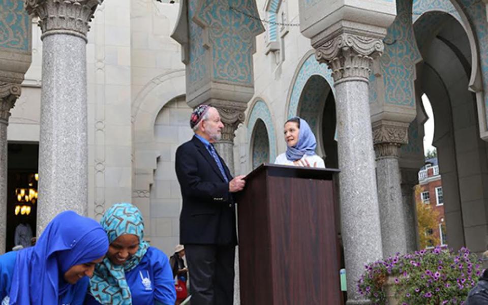 woman speaking at the podium 