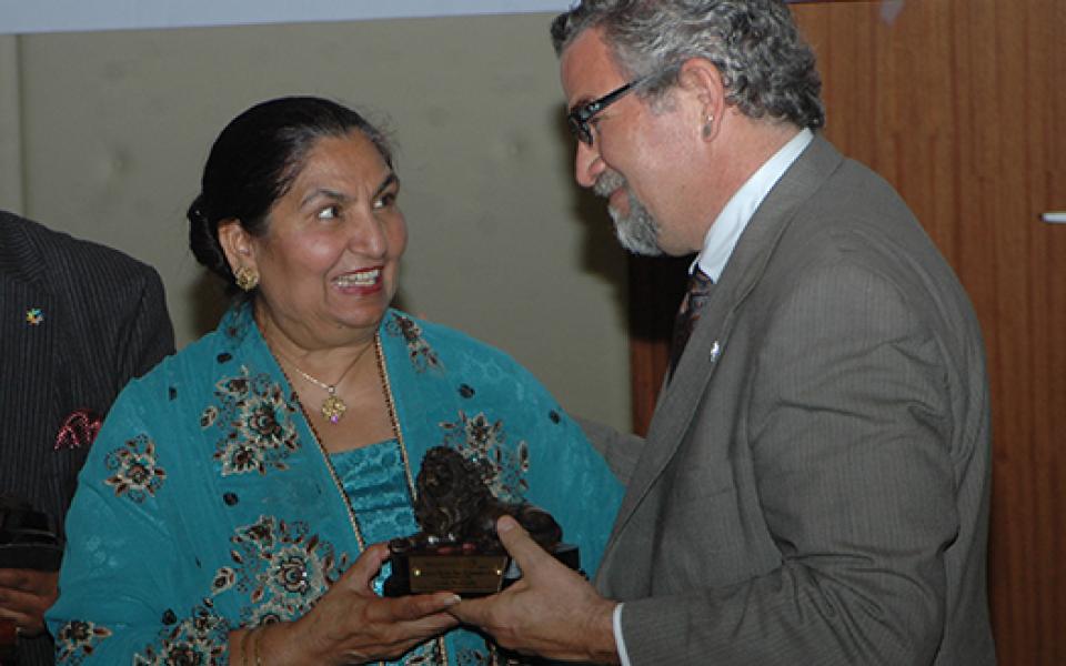 victor smiling with a women leader 