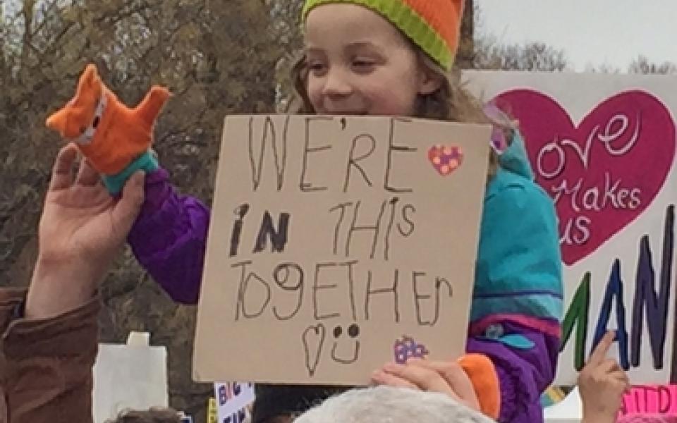 A children holding a sign   