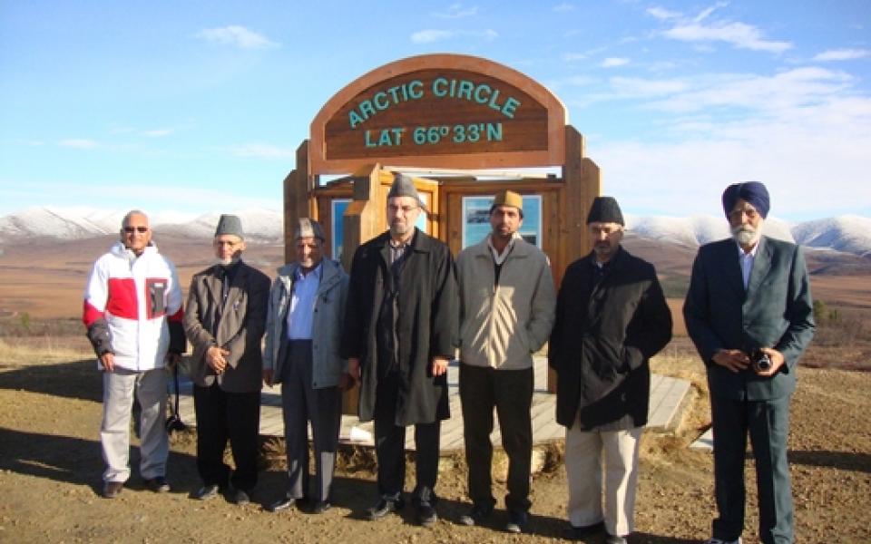 men standing in front of the arctic circle 