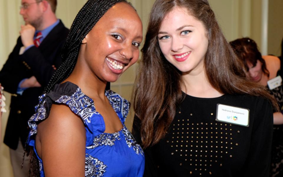 two young girls taking a photo