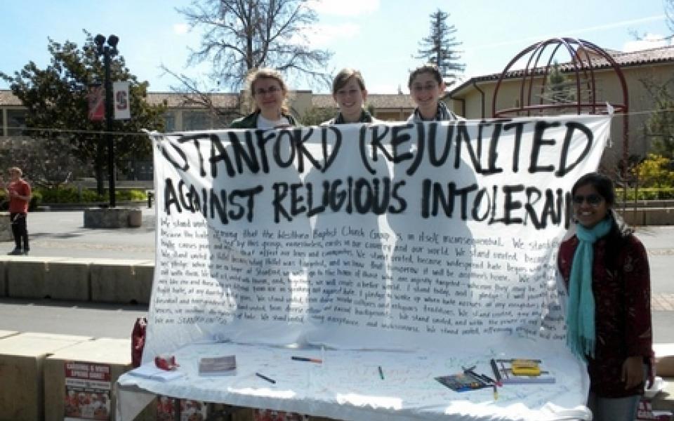 women holding a poster 