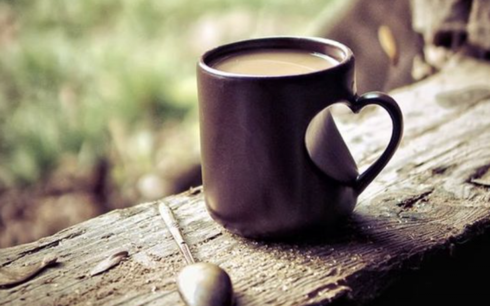 a mug with a heart handle