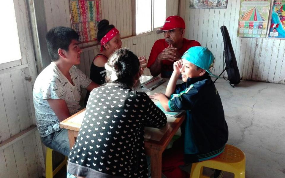 Photo of people sitting around a table