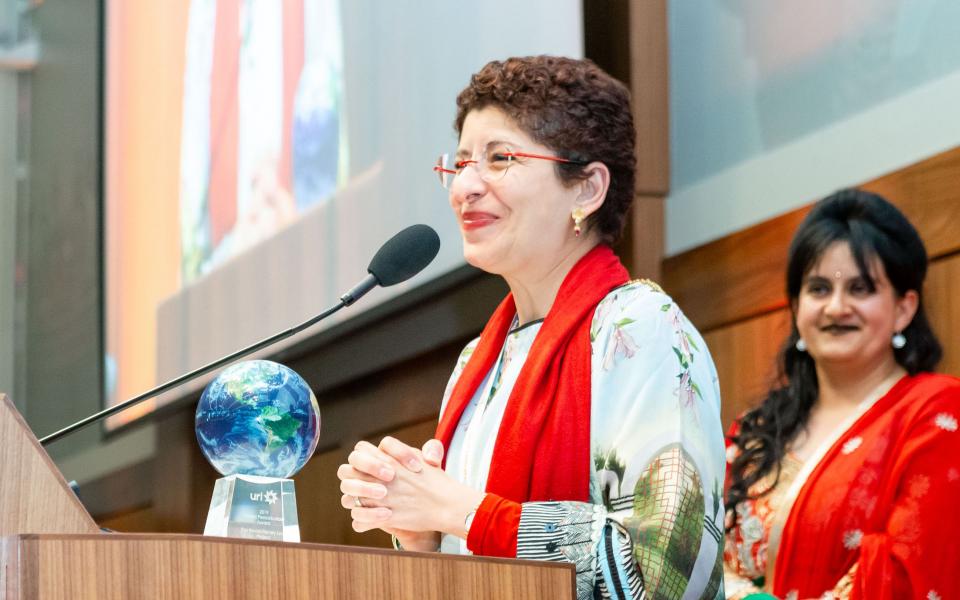 Azza Karam Receiving URI's Global Peacebuilder Award for the United Nations Population Fund