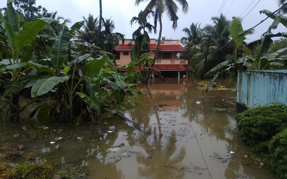Photo of 2018 Kerala flood devastation by Ranjithsiji via Wikicommons