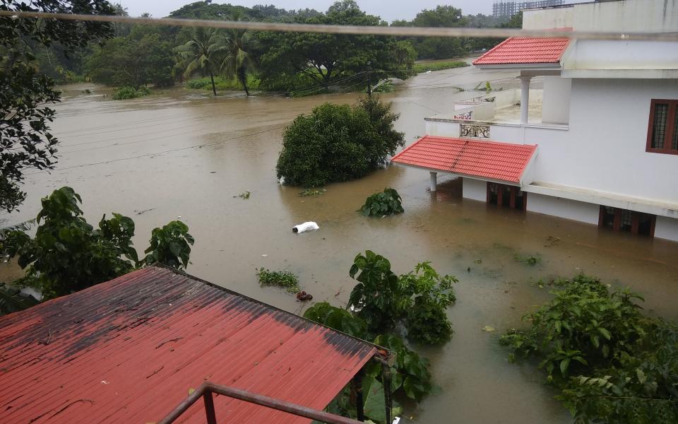 Photo of flood devastation by Ranjithsiji via Wikicommons